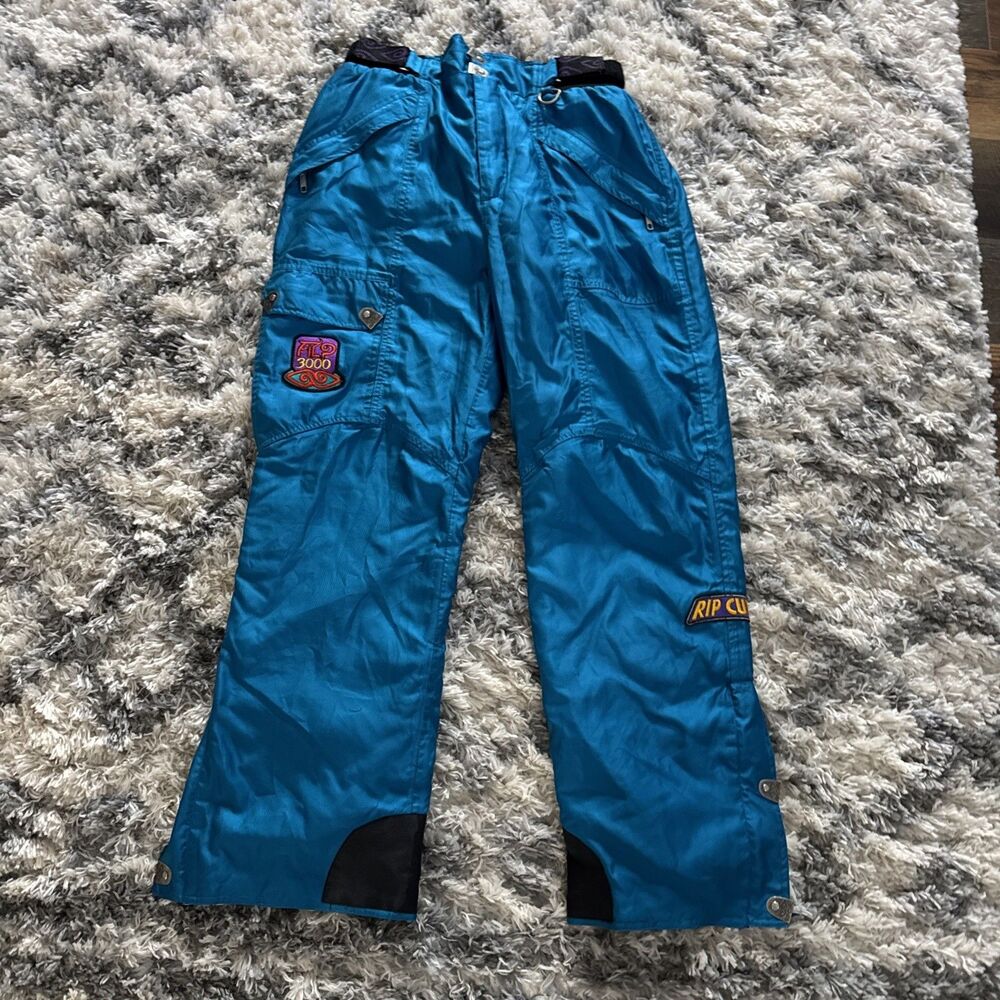 vintage teal Rip Curl ski / Snowboard Pants feature a prominent "Rip Curl 3000"